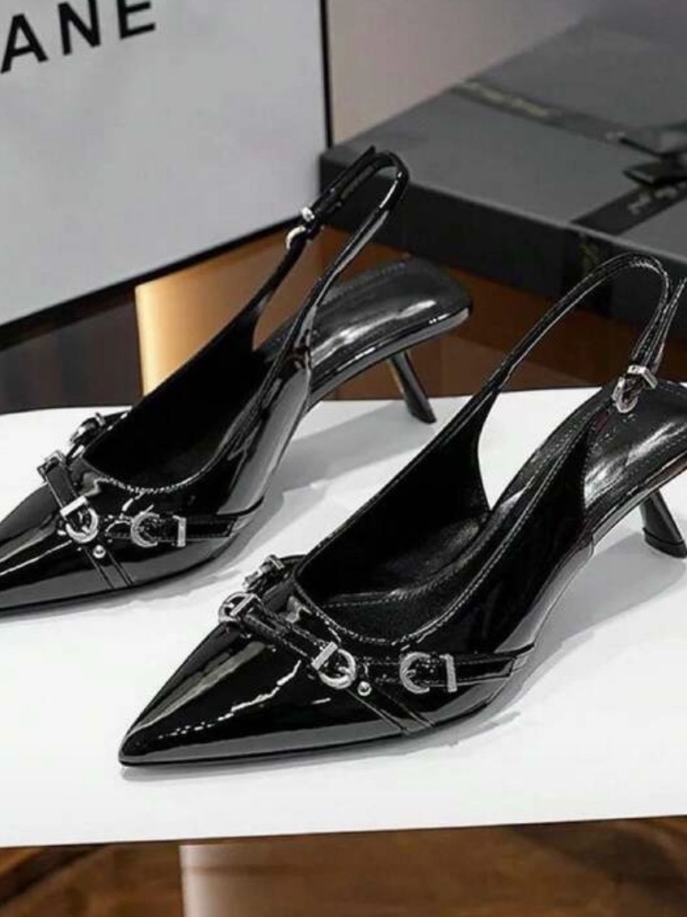 Black Patent Pointed Slingback Heels with Silver Buckle Detail